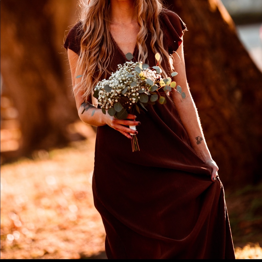 Rust-colored, full-length Baltic Born dress